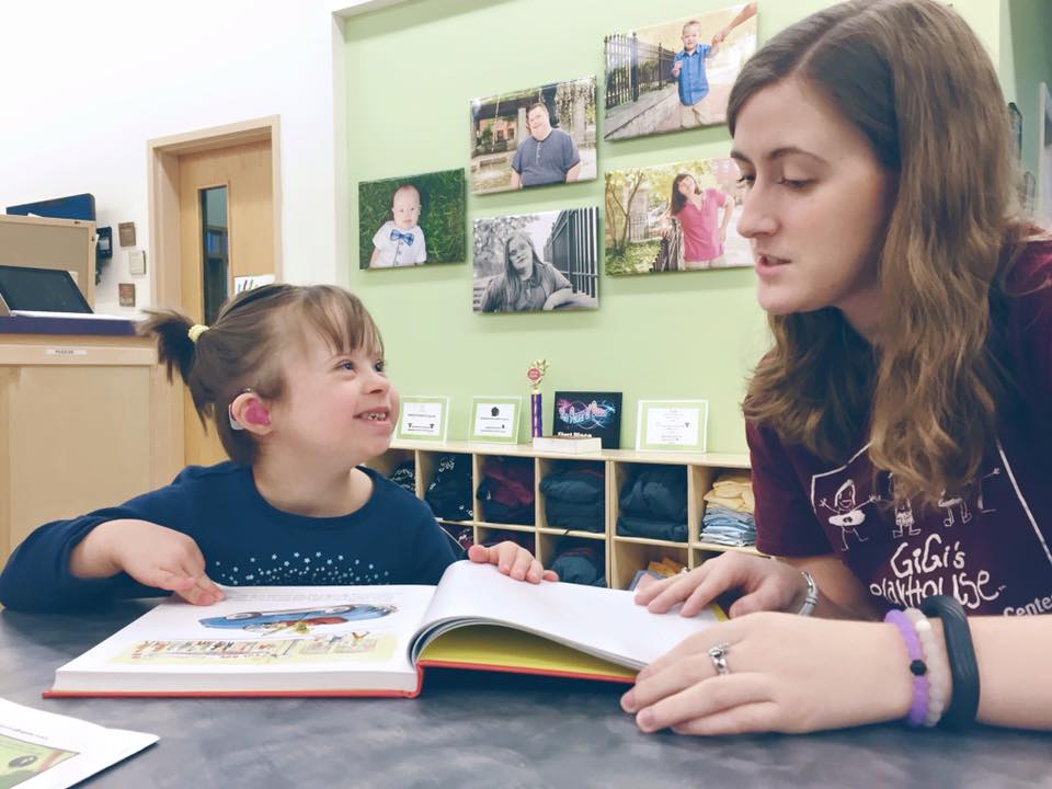 little girl with Down syndrome recieves free literacy tutoring at GiGi's Playhouse