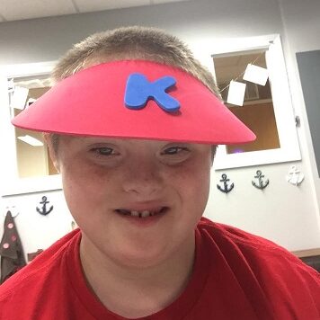 Kayden smiles modelling his new visor!