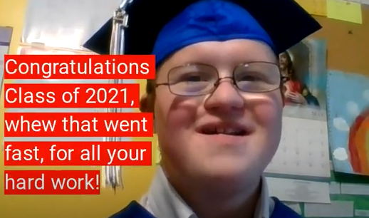 Graduate with Down syndrome wearing a blue graduation cap and smiling