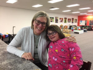 literacy tutor and student with Down syndrome