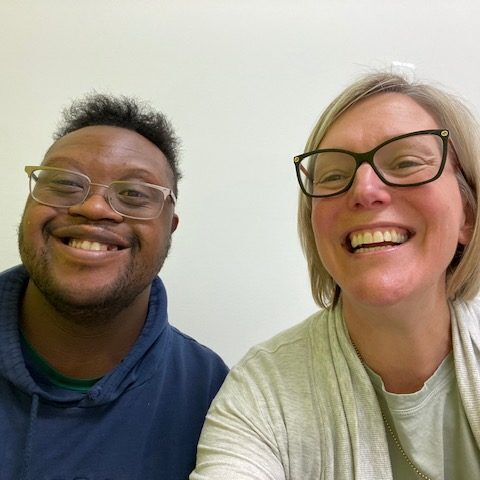 literacy tutor and student with Down syndrome