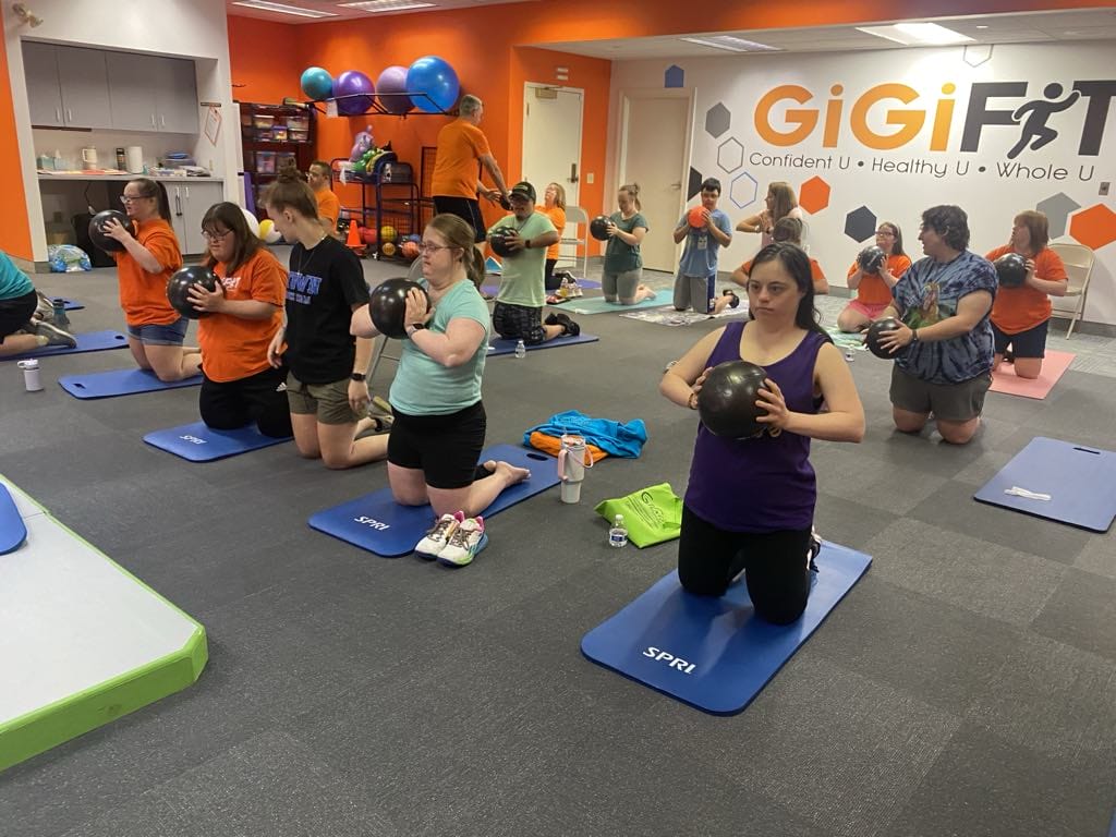 A group of teens working out during GiGiFit