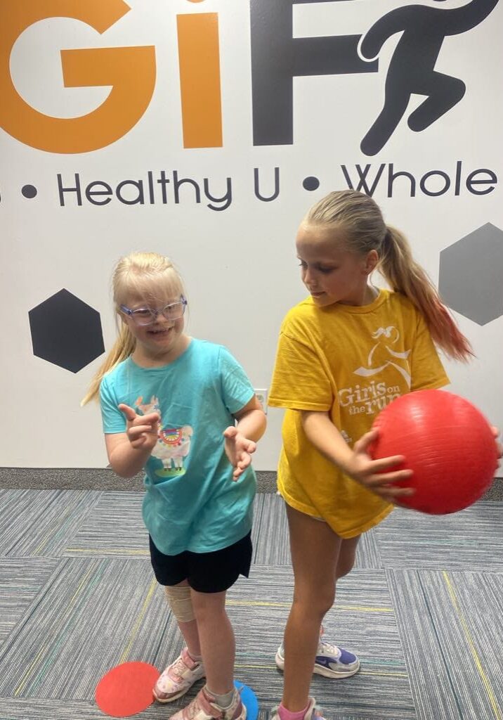 Annabelle and Hannah passing the ball