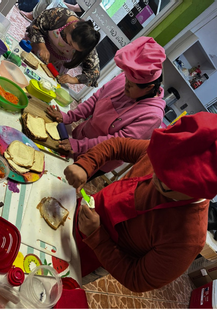 Kids doing activity standing around the table
