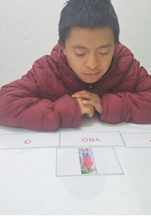 kid in maroon hoodie reading