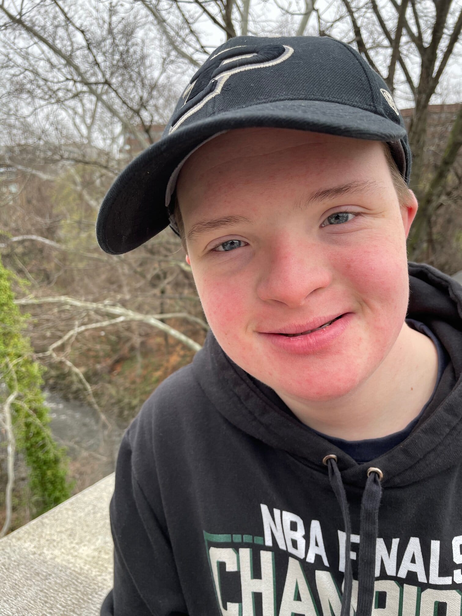 Jake is a teen with Down syndrome. Jake is seen here wearing is favorite team hat - Purdue University!