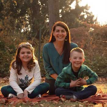 woman with children in a fall setting