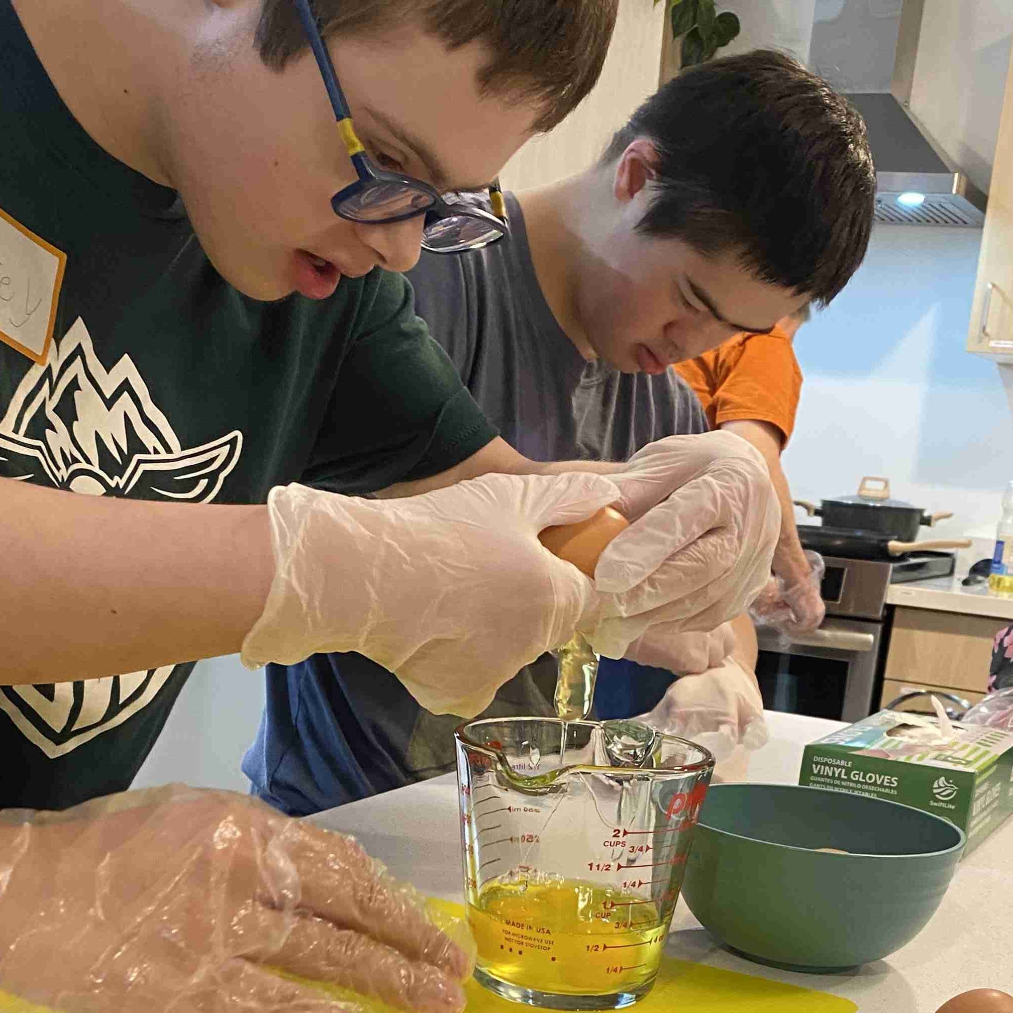 person-with-down-syndrome-cracking-eggs