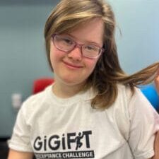 Girl in white t-shirt, holding her hair