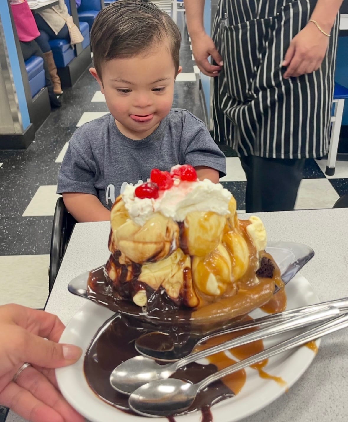 Teddy enjoys a huge ice cream sundae