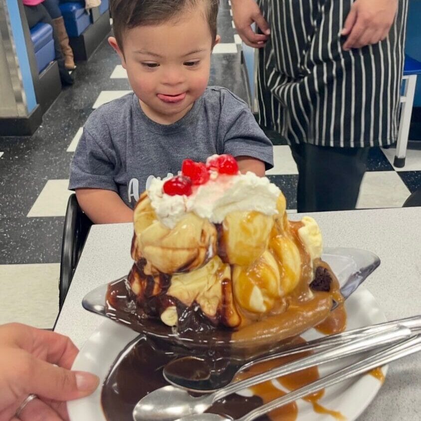 Teddy enjoys a huge ice cream sundae