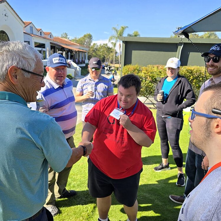 golf-with-a-purpose-clark meetig golfers GiGi's Playhouse San Diego Ambassador Clark meeting some Golfers at last year's Golf With A Purpose Tournament.