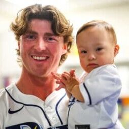 baseball player with baby