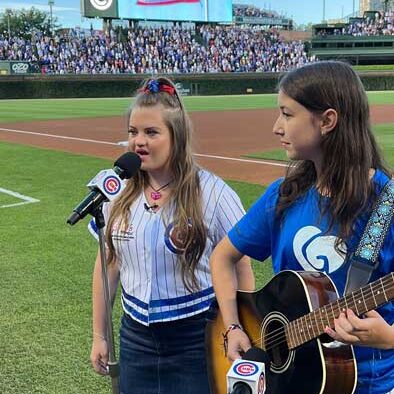 GiGi singing the National Anthem at a Chicago Cub game