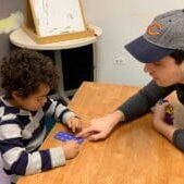math-tutoring adult teaching a child to do math